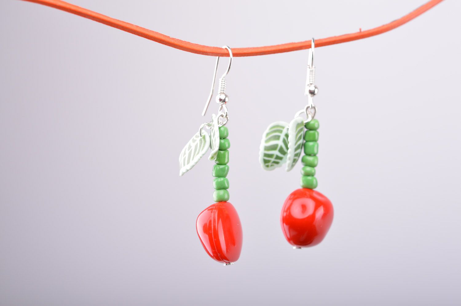 Homemade long polymer clay earrings with charms in the shape of cherries photo 2