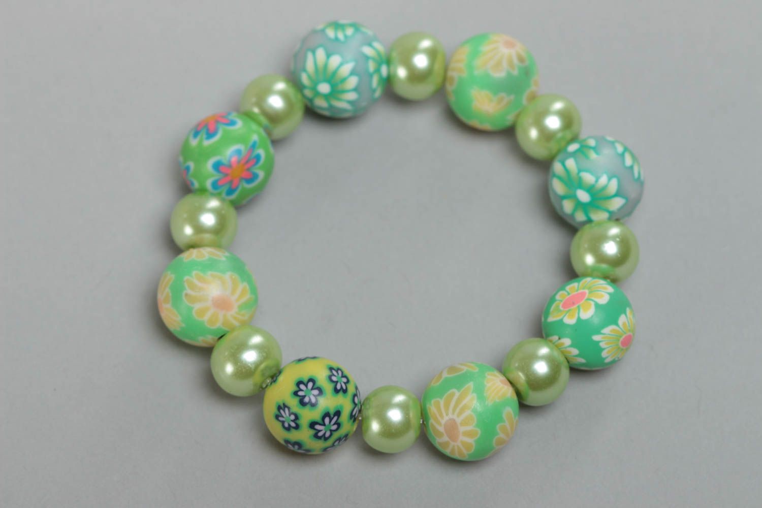 Beautiful children's handmade polymer clay wrist bracelet of green color photo 2