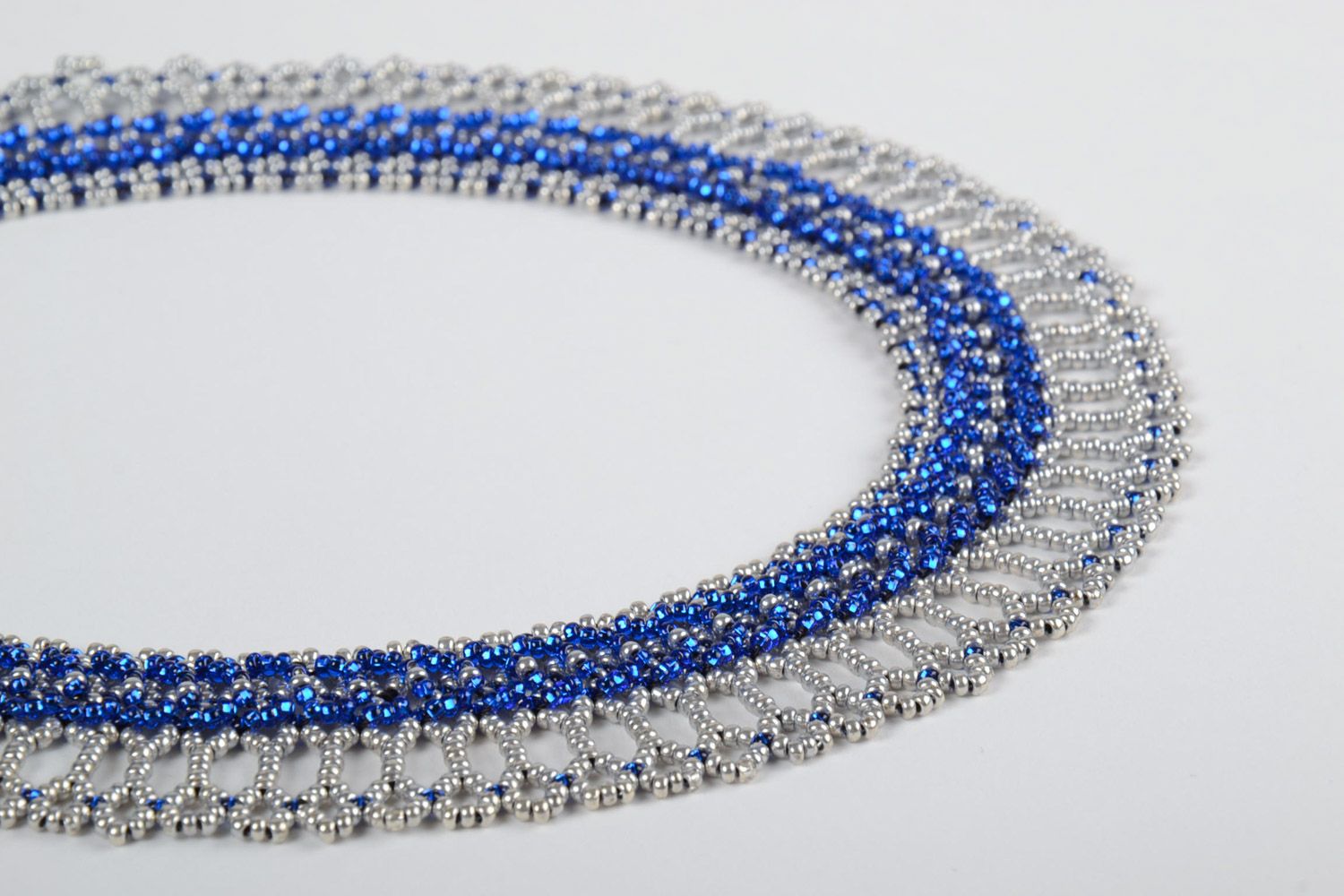 Beautiful lacy handmade women's beaded necklace of blue and white colors photo 4