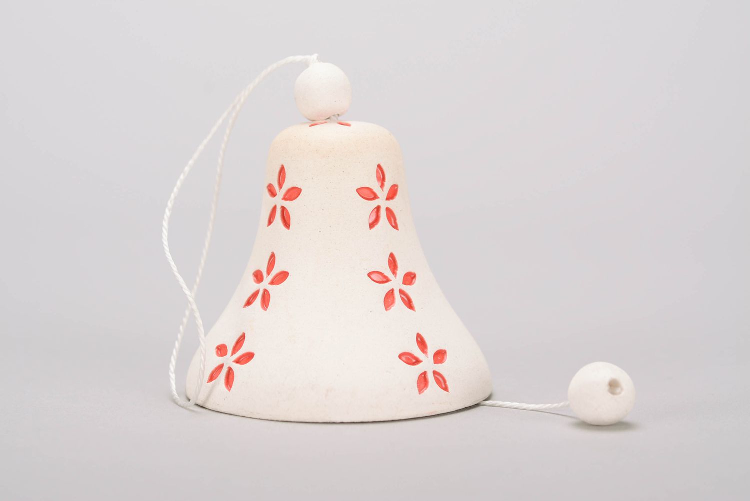 Bell made of white clay photo 3
