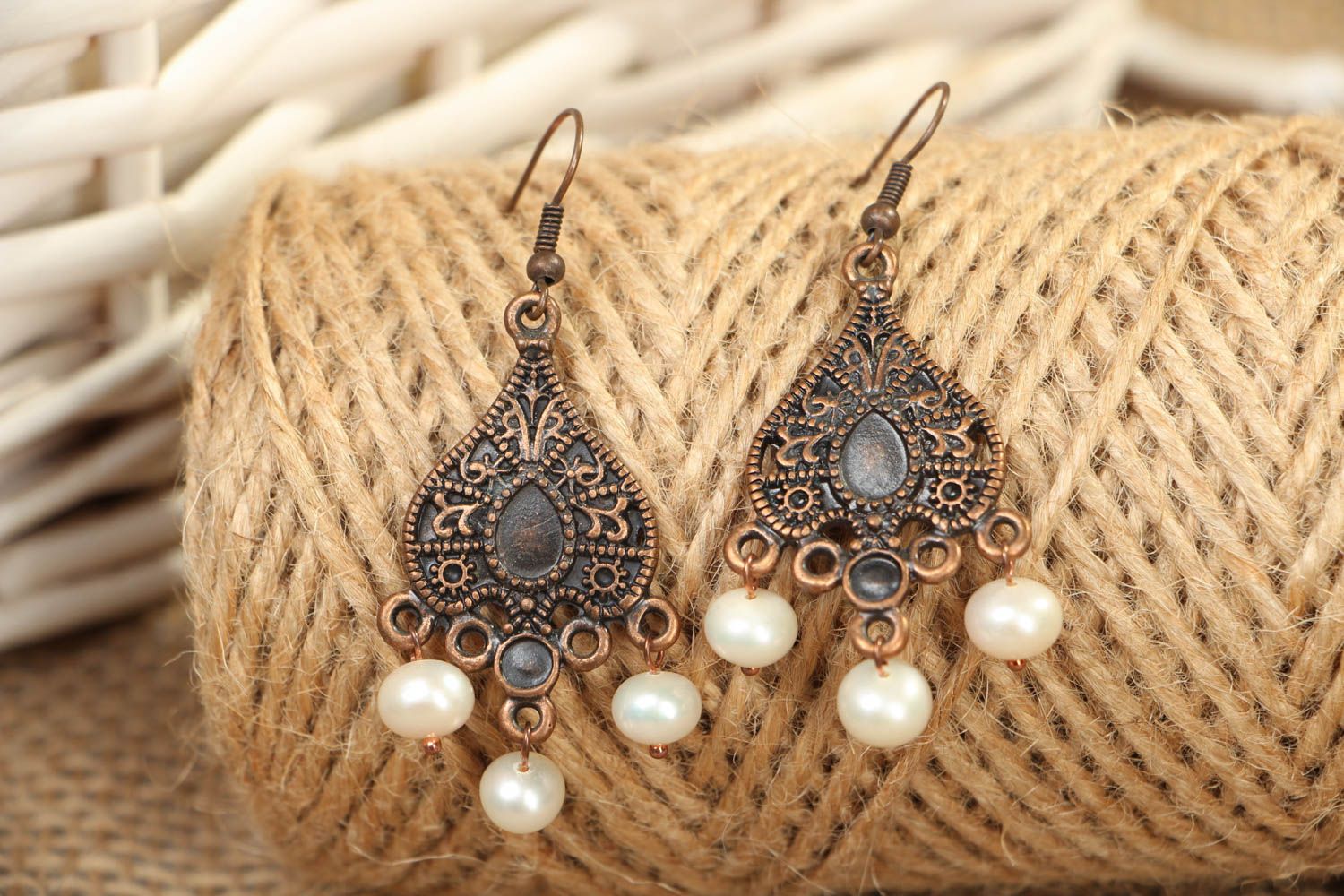 Metal earrings in Orient style with pearl-like beads photo 4
