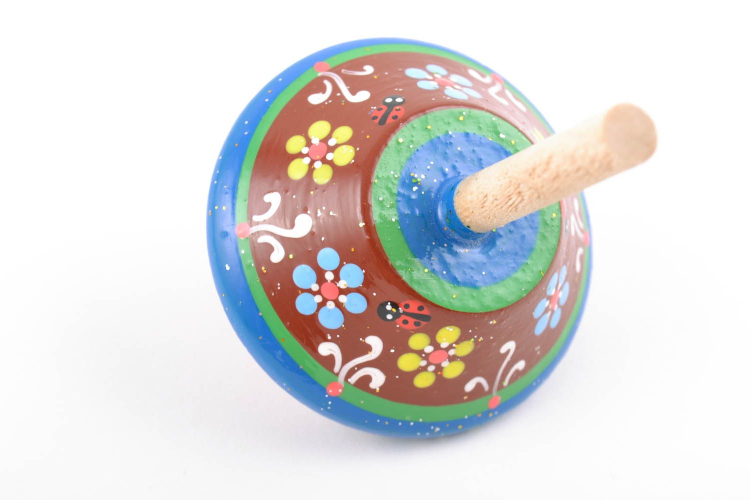 Petit jouet toupie avec peinture de couleurs écologiques fait main en bois photo 3