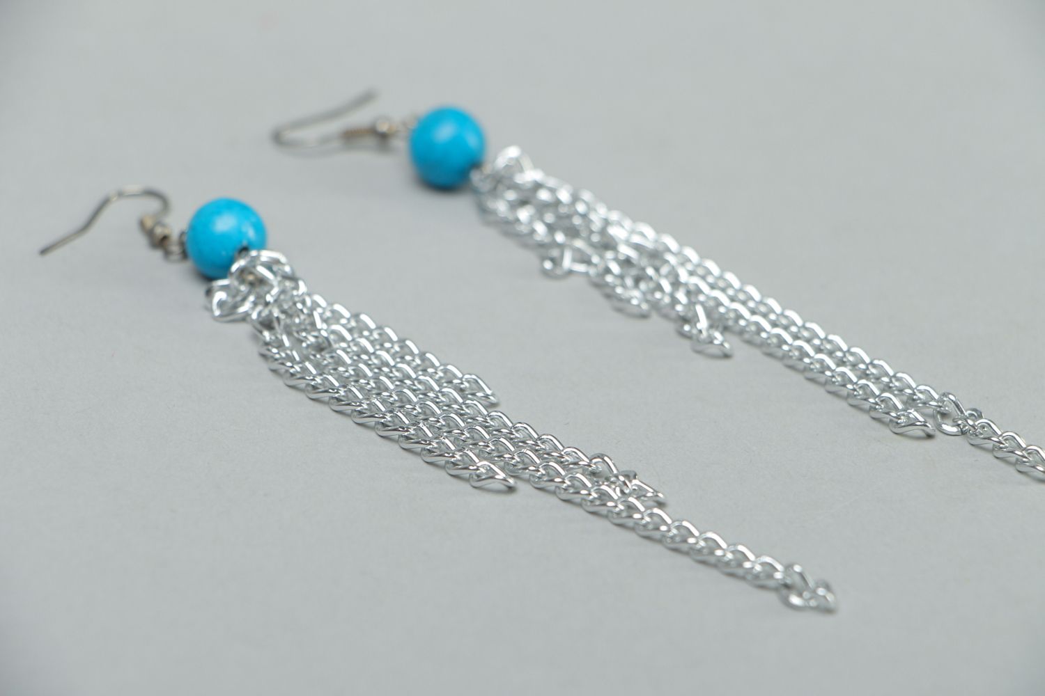 Metal earrings with chains and beads photo 2