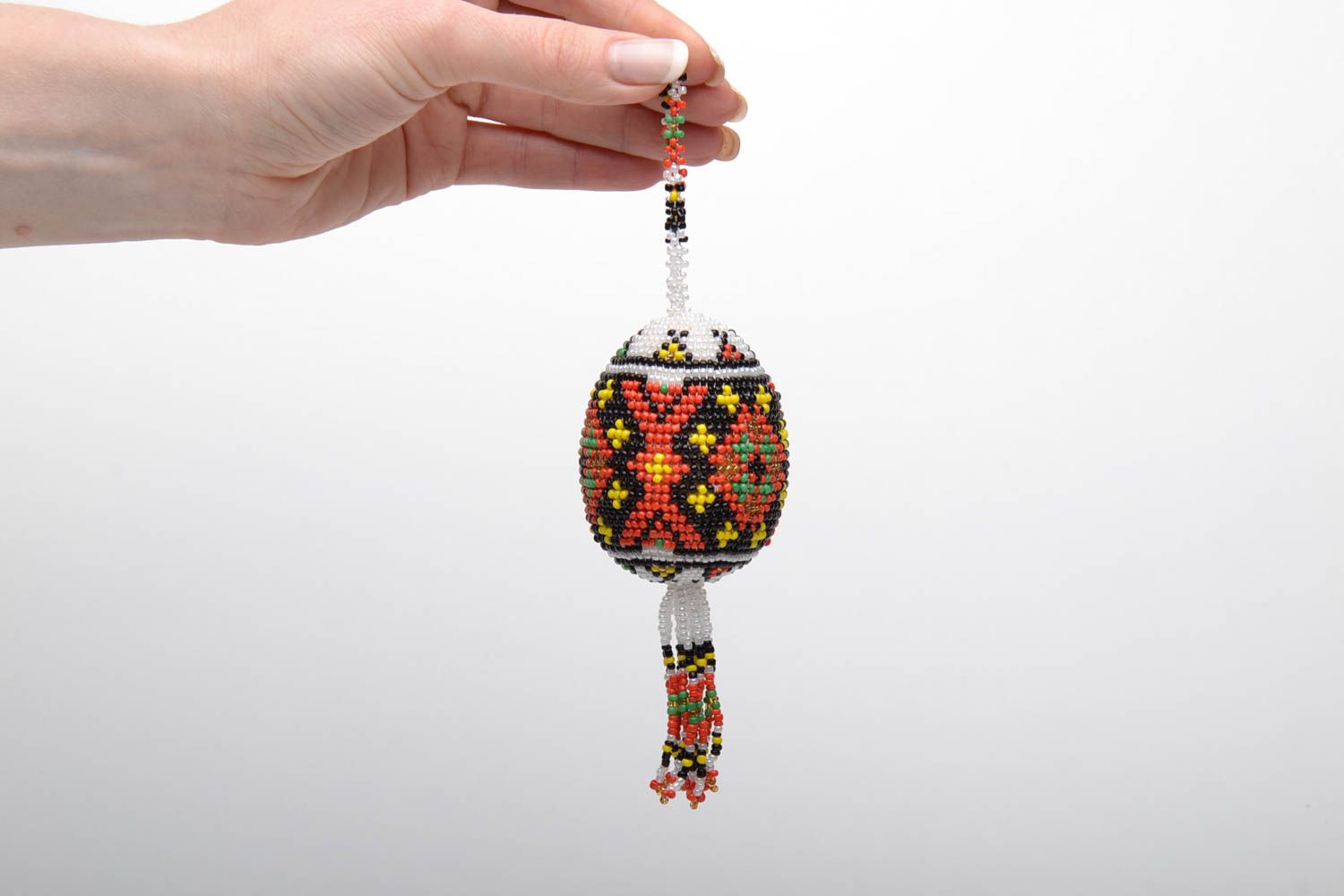 Decorative pendant in the shape of a wooden egg woven over with beads photo 2