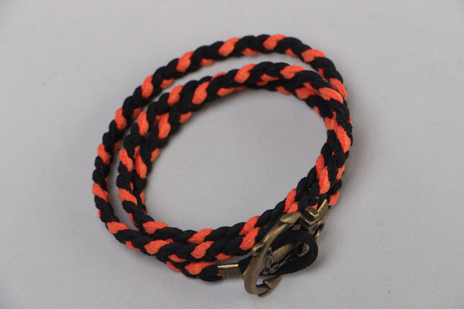Handmade marine bracelet woven of faux suede cord of black and orange colors photo 2