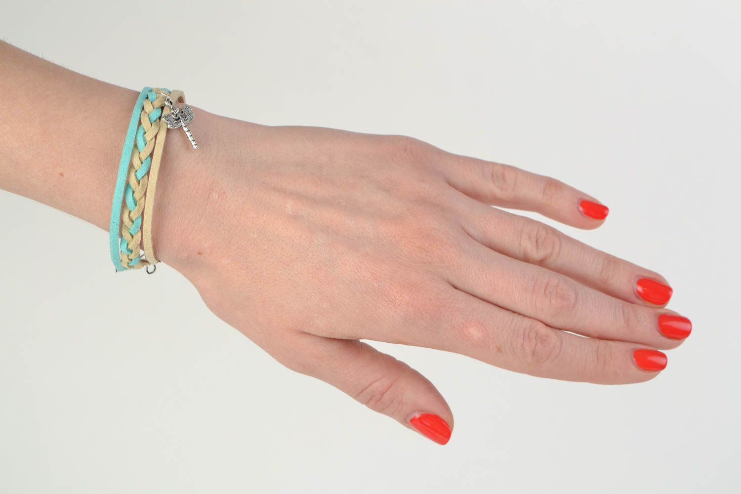 Beautiful stylish light handmade woven suede cord bracelet with charm photo 2