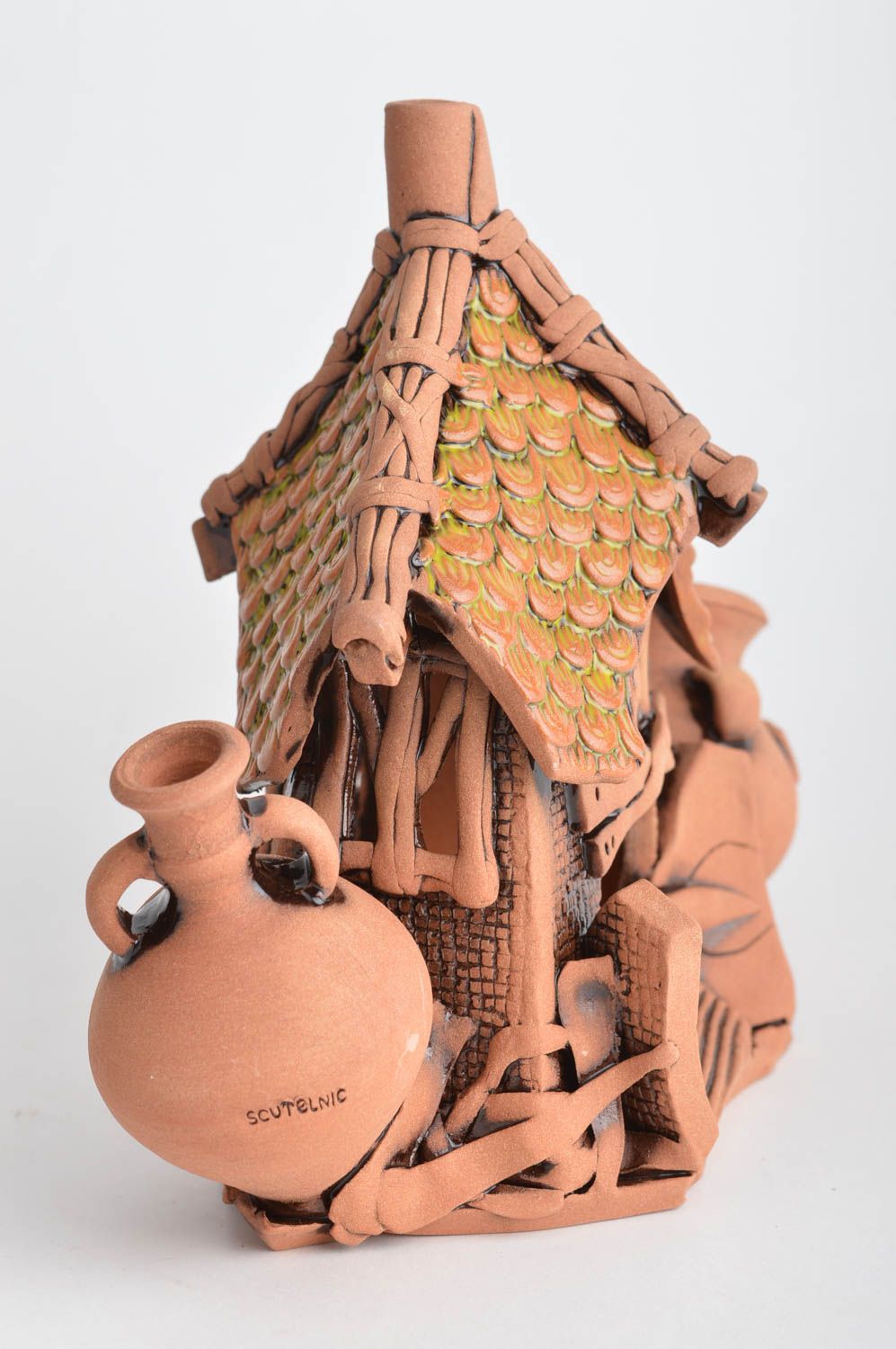 Handmade designer decorative ceramic candle holder styled on house for interior photo 5