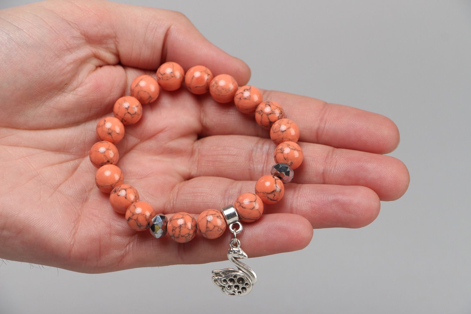 Handmade coral bracelet with metal charm in one turn photo 3