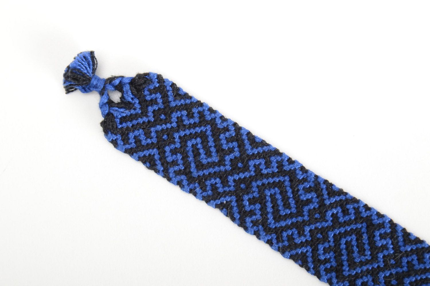 Handmade friendship bracelet woven of threads with blue and black ornament  photo 4