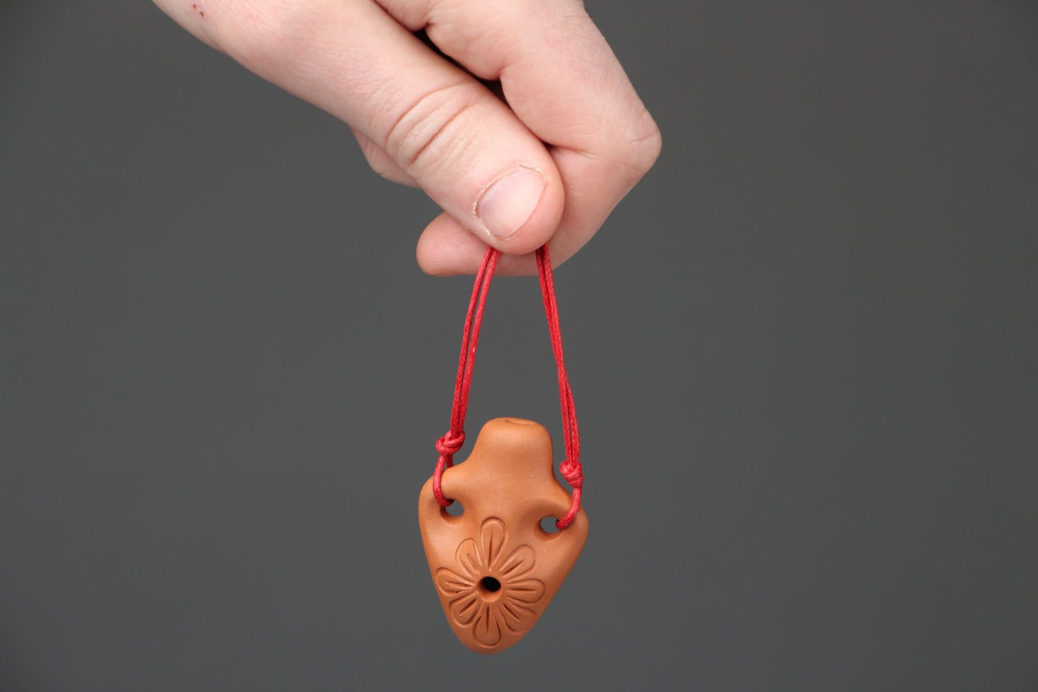 Clay penny whistle in the shape of amphora photo 4