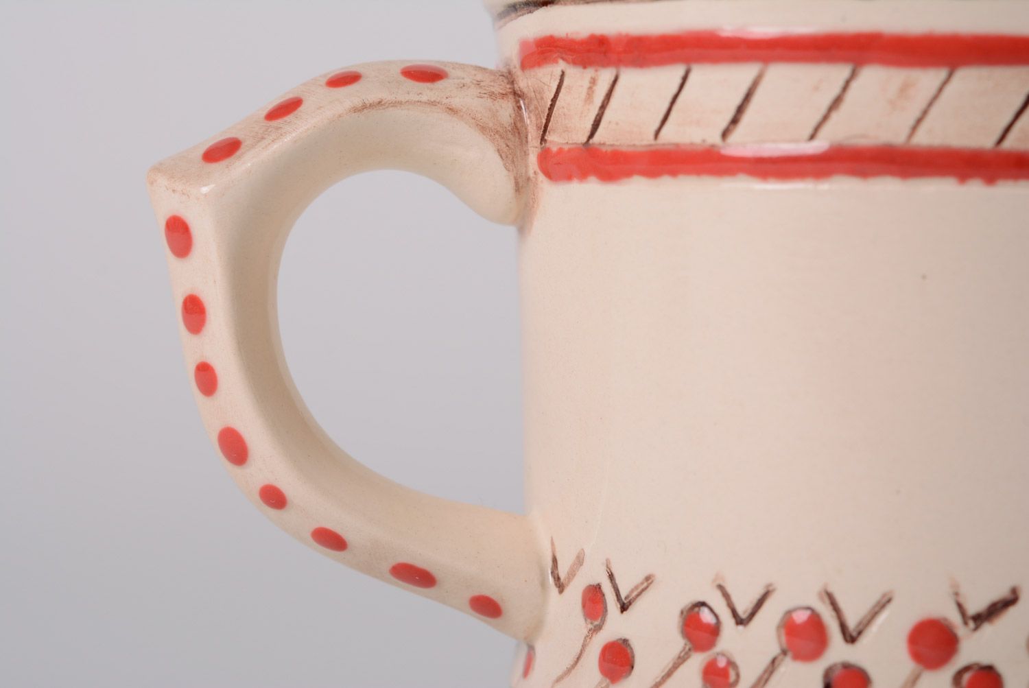Glazed maiolica ceramic cup painted with red and green dots in the Ukrainian style photo 2