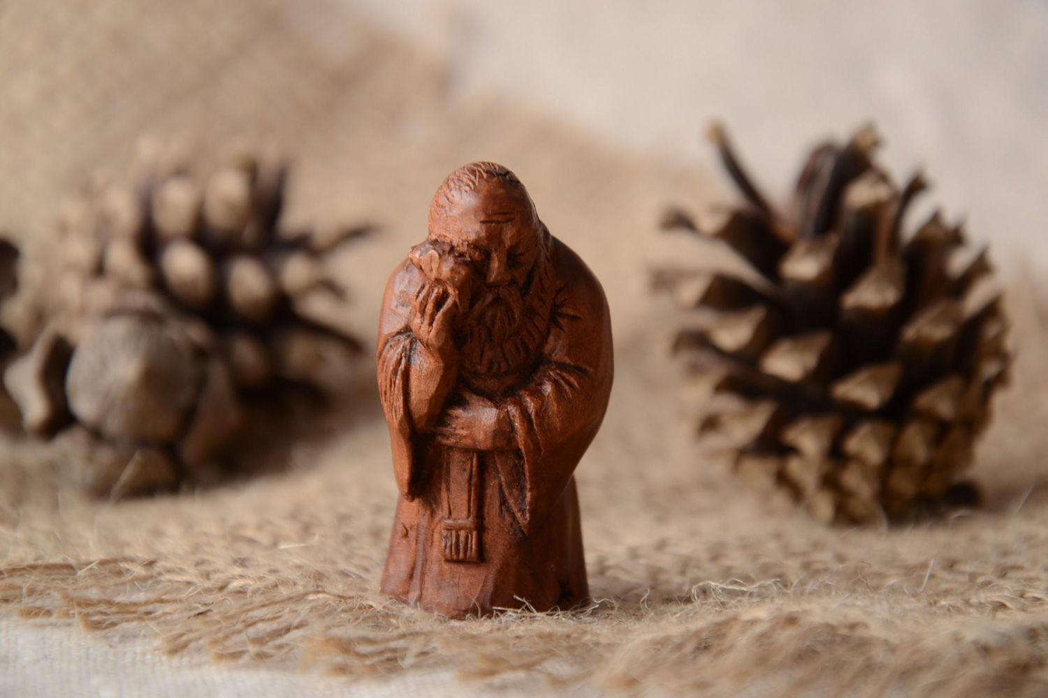 Handmade miniature carved wooden figurine of wise man for interior decoration photo 1