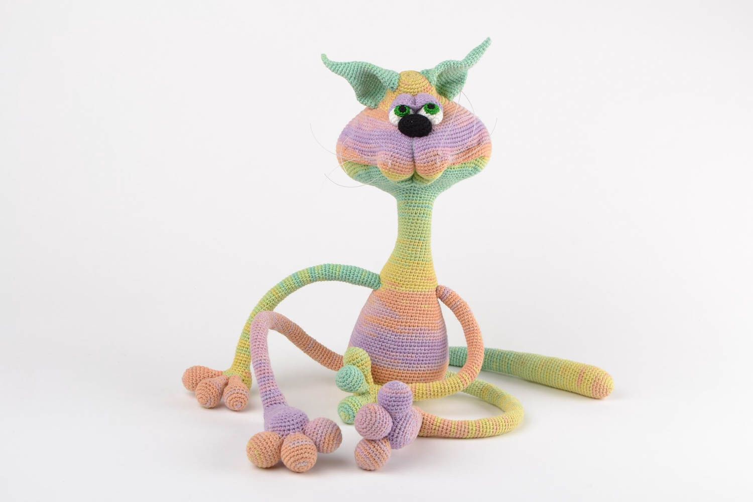Handmade designer soft toy crocheted of acrylic threads cat of rainbow coloring photo 2