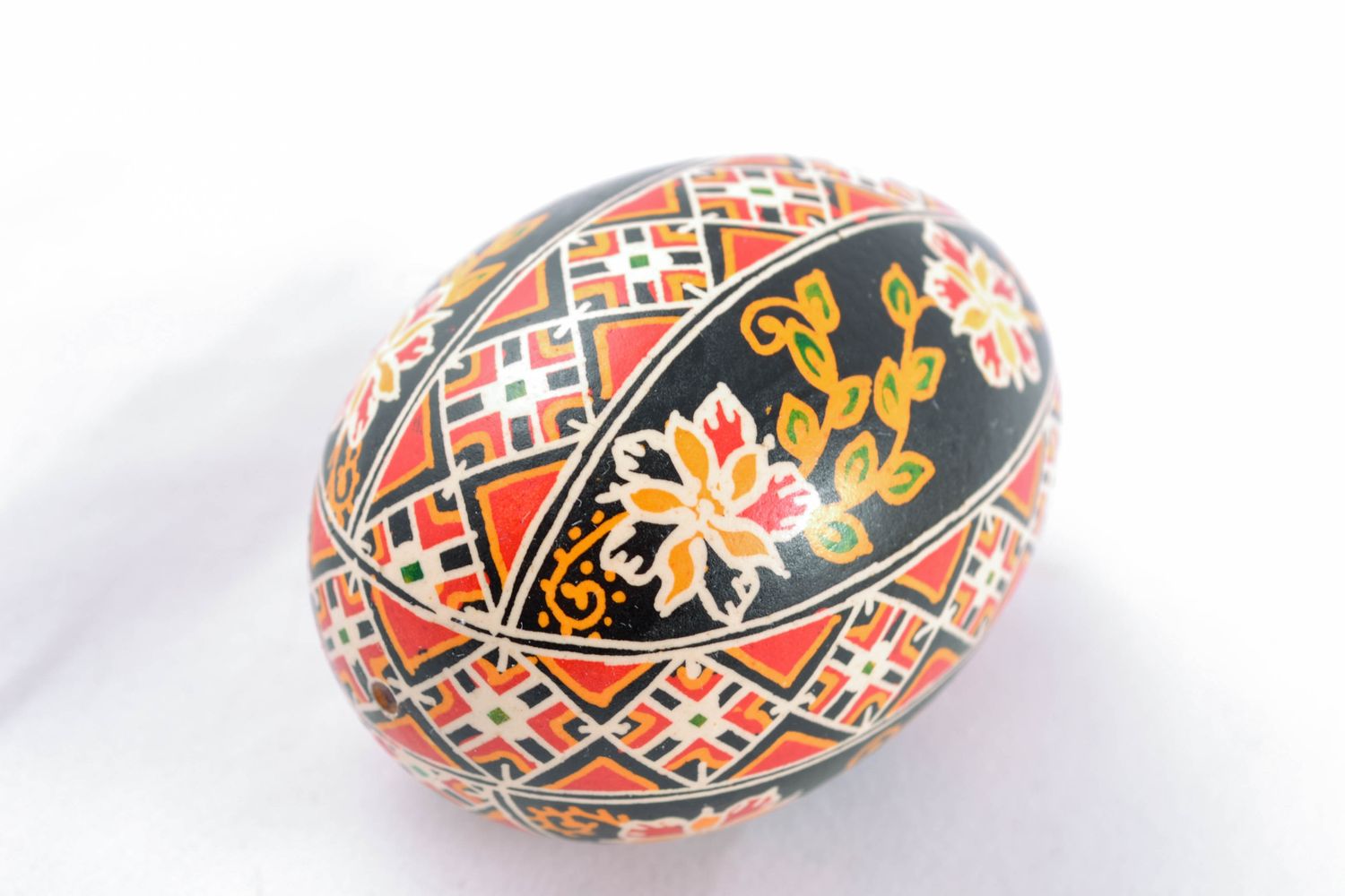 Chicken Easter egg of black color with colorful ornament photo 2