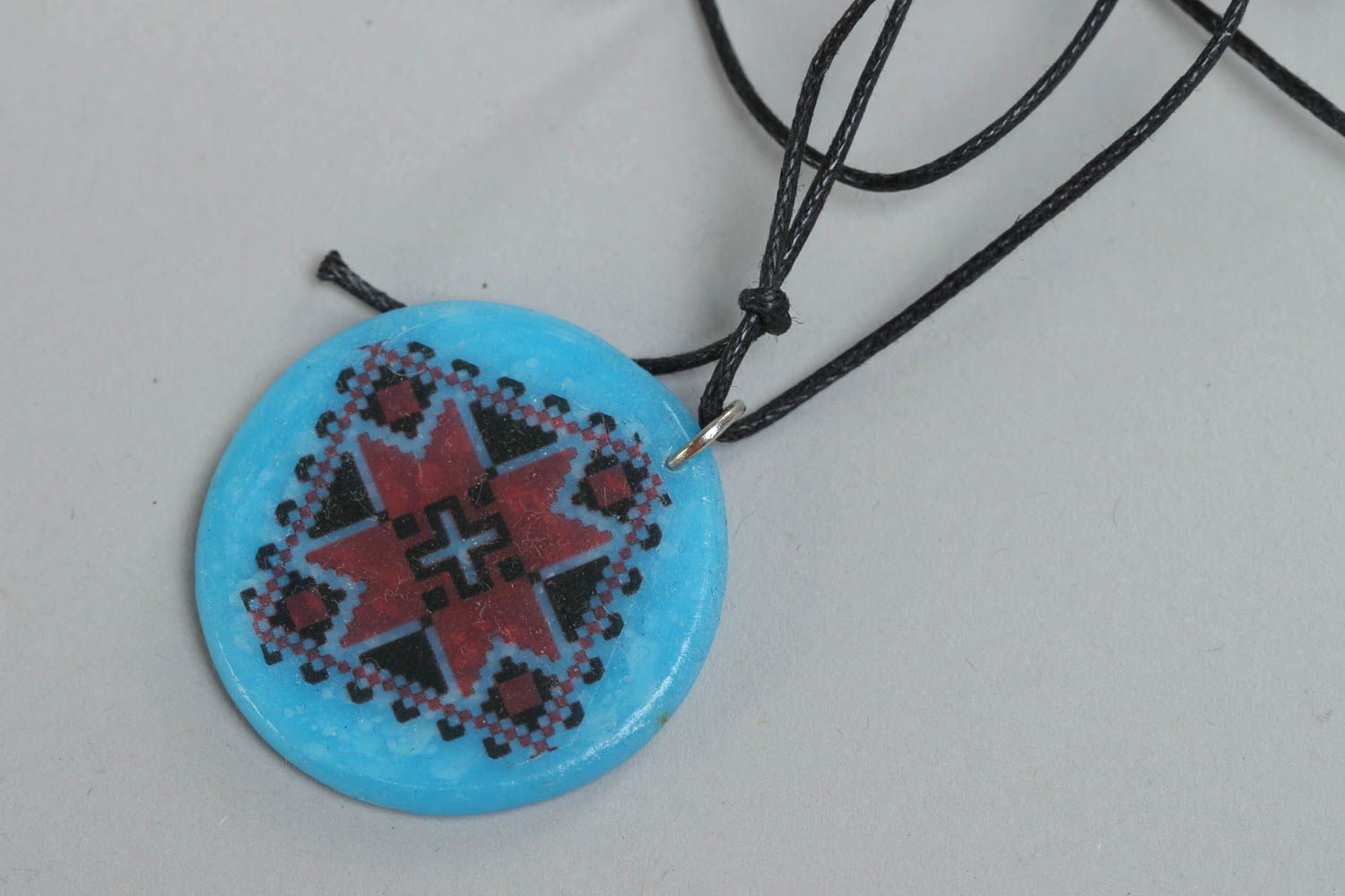 Handmade designer pendant with Ukrainian symbols round blue accessory on cord  photo 2