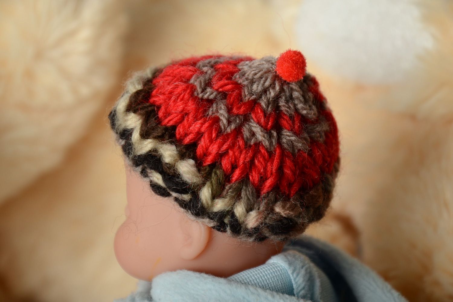 Knitted red hat for a baby toy. Two inches in diameter photo 1