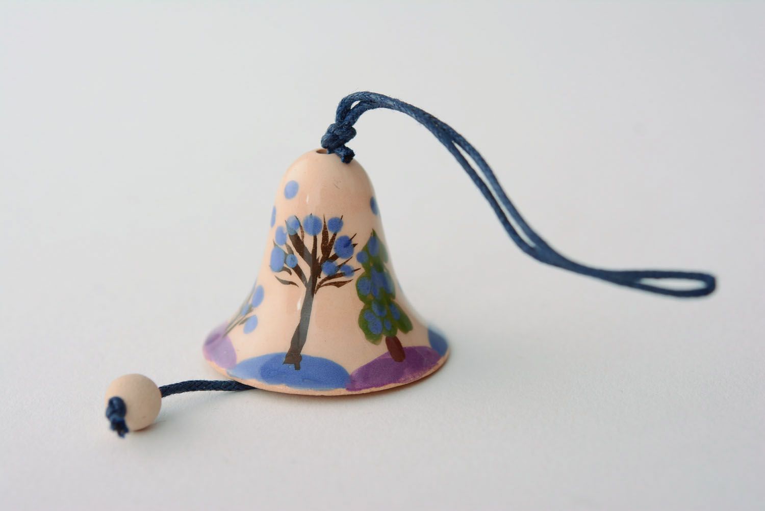 Small ceramic bell with a cord photo 2