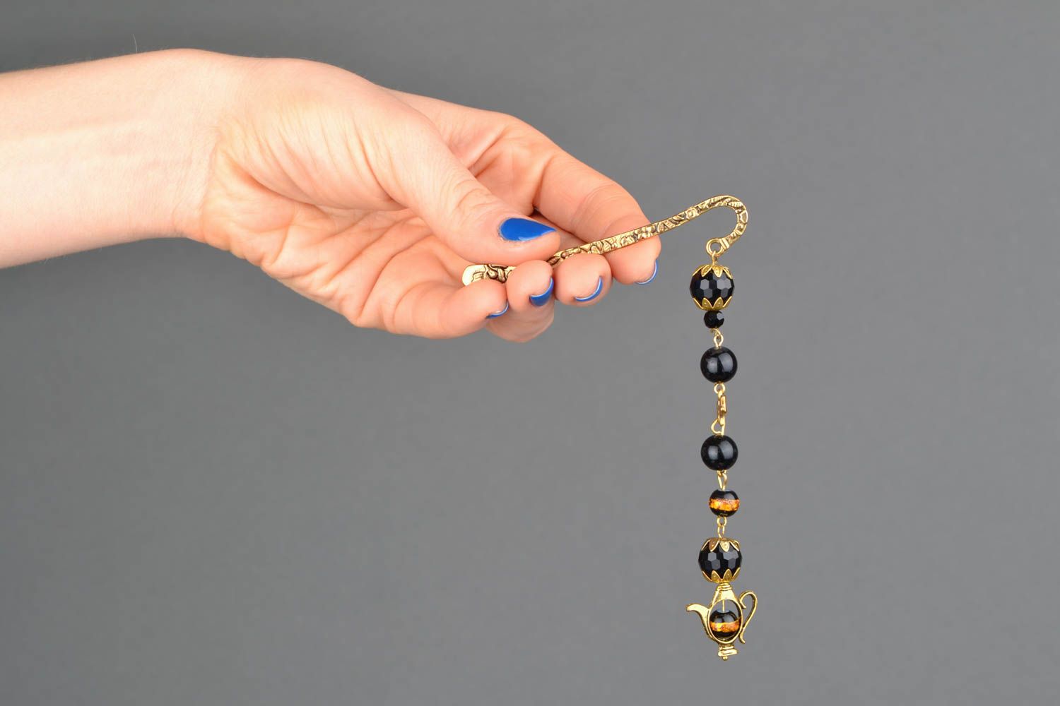Golden-like bookmark with black beads photo 2