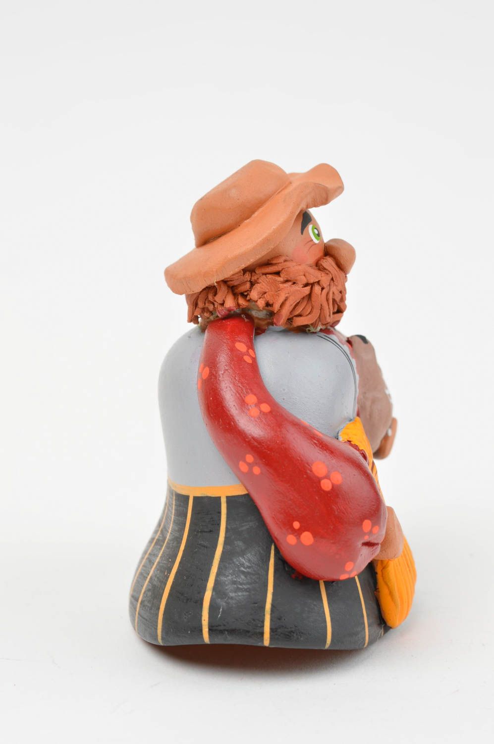 Интересный глиняный колокольчик в виде мужичка с совой ручной работы расписной фото 2