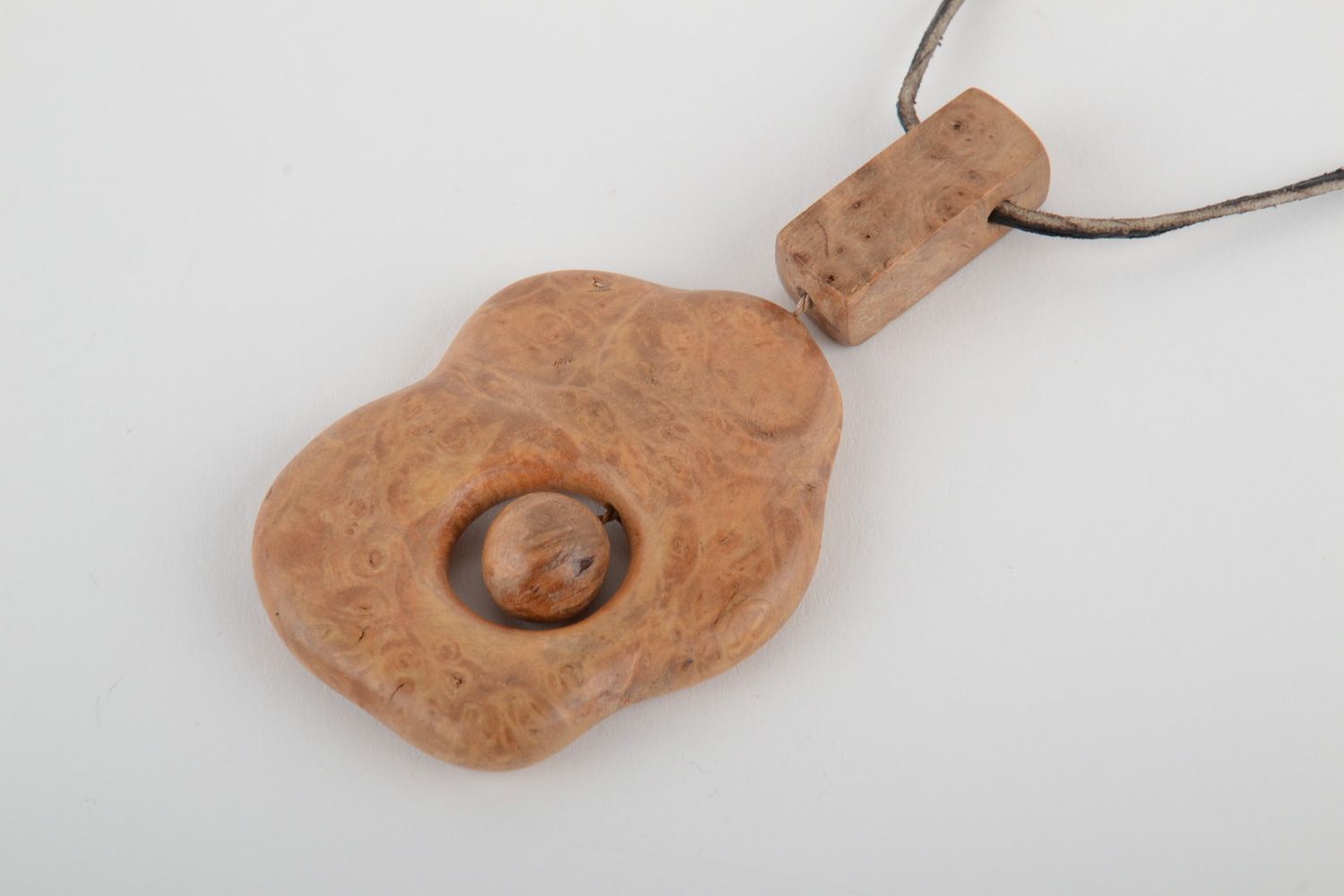 Handmade tinted varnished pendant carved of wood in ethic style for women photo 3