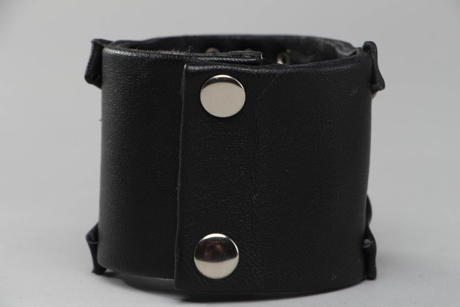 Wide leather bracelet with metal inserts photo 2