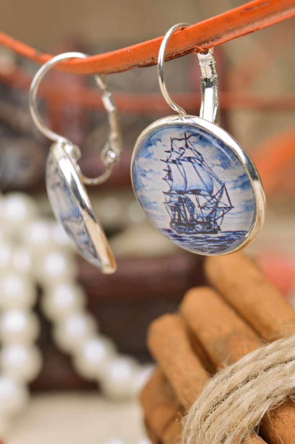 Handmade designer dangle earrings on metal basis with pattern in marine style photo 1