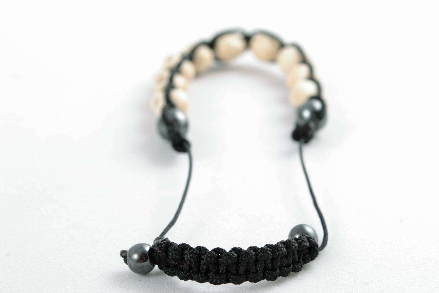Bracelet woven of beads in the shape of skulls photo 3