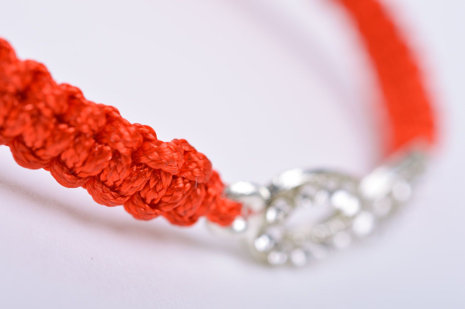 Handmade thin friendship wrist bracelet woven of red threads with infinity sign photo 4