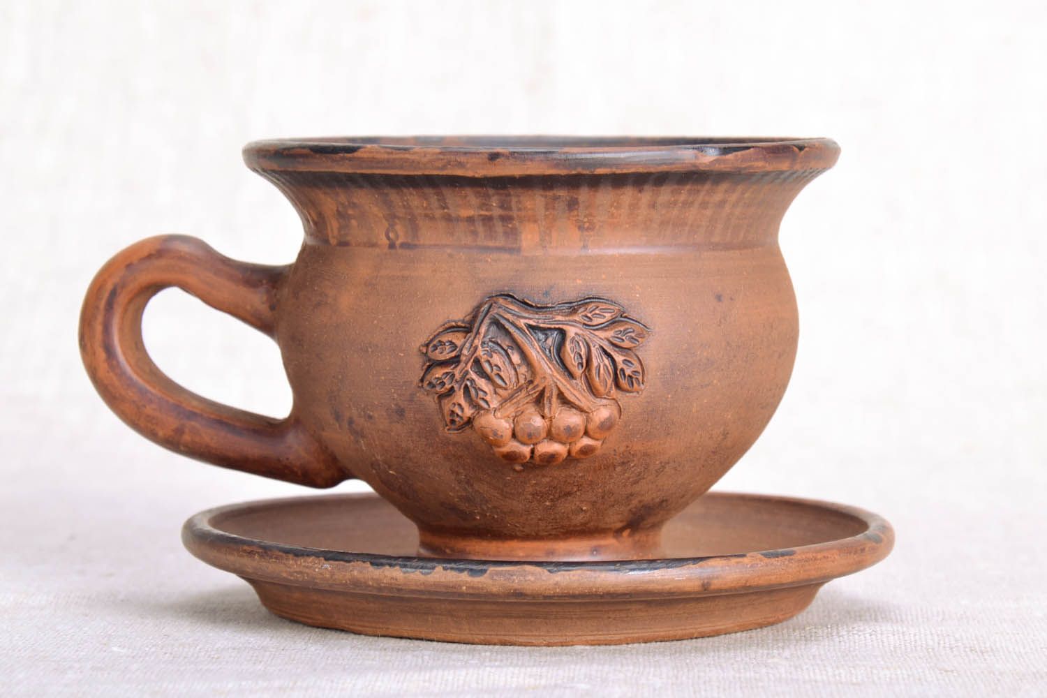 5 oz clay coffee cup with handle and saucer in light brown color with grapes' pattern photo 2