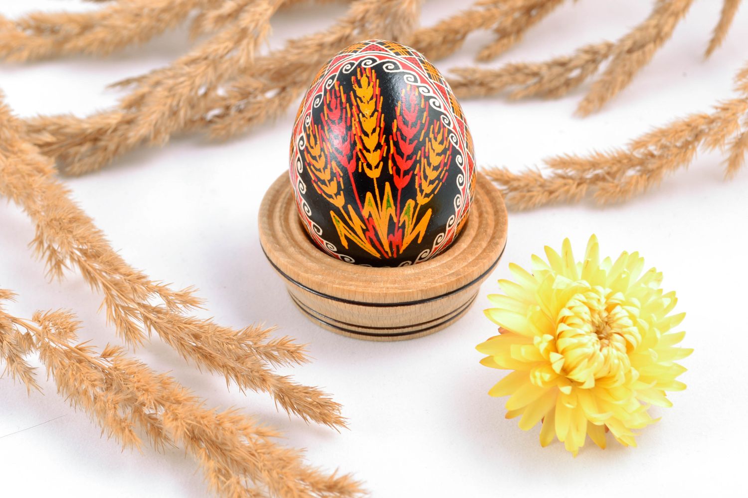 Handmade painted chicken egg with the image of wheat ears photo 1