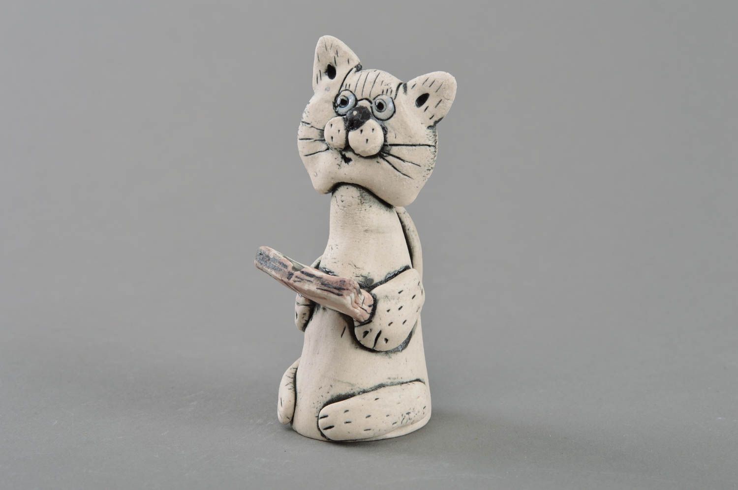 Porcelain handmade statuette painted with glaze and acrylics Cat with book photo 1