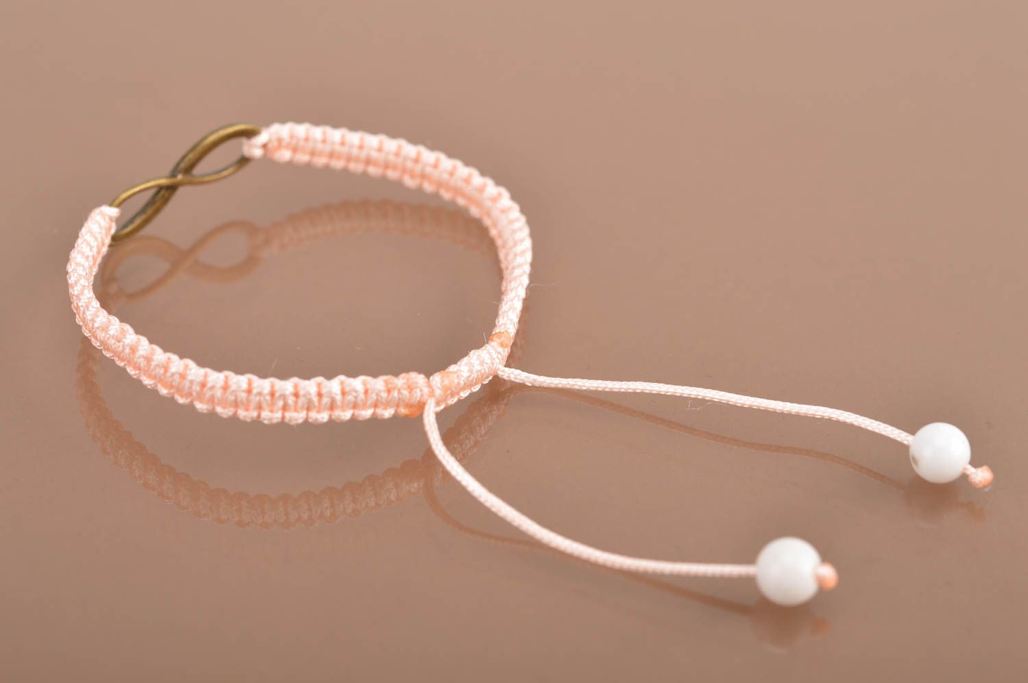 Handmade stylish thin pink woven wrist bracelet made of silk with insert photo 5