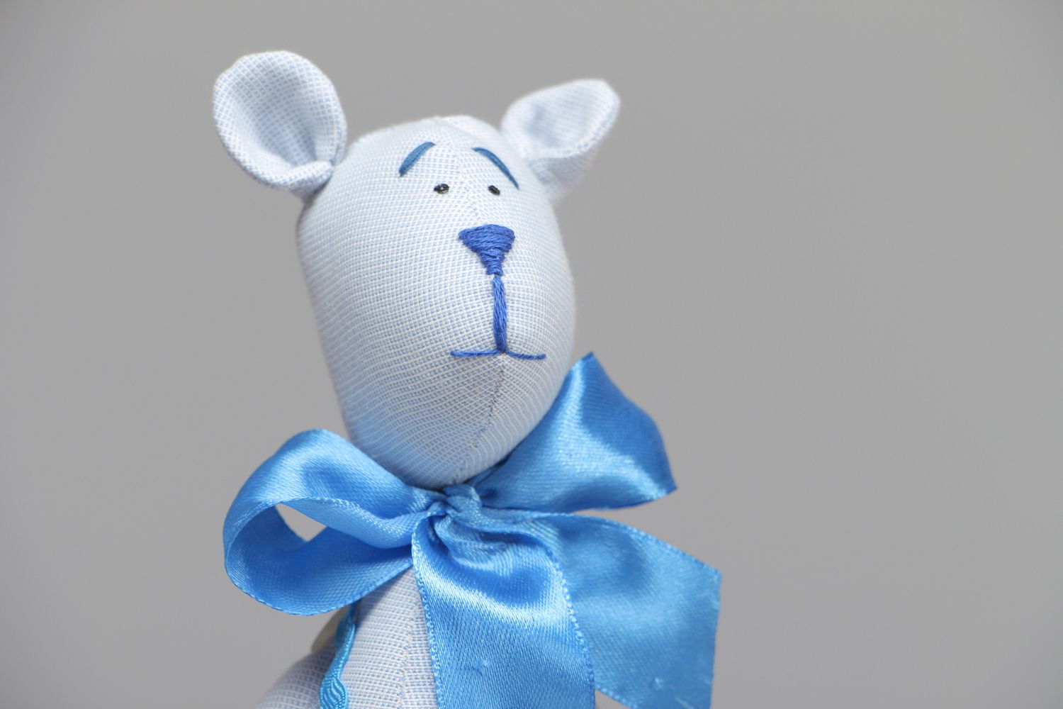 Textile toy bear with bow on the neck photo 2