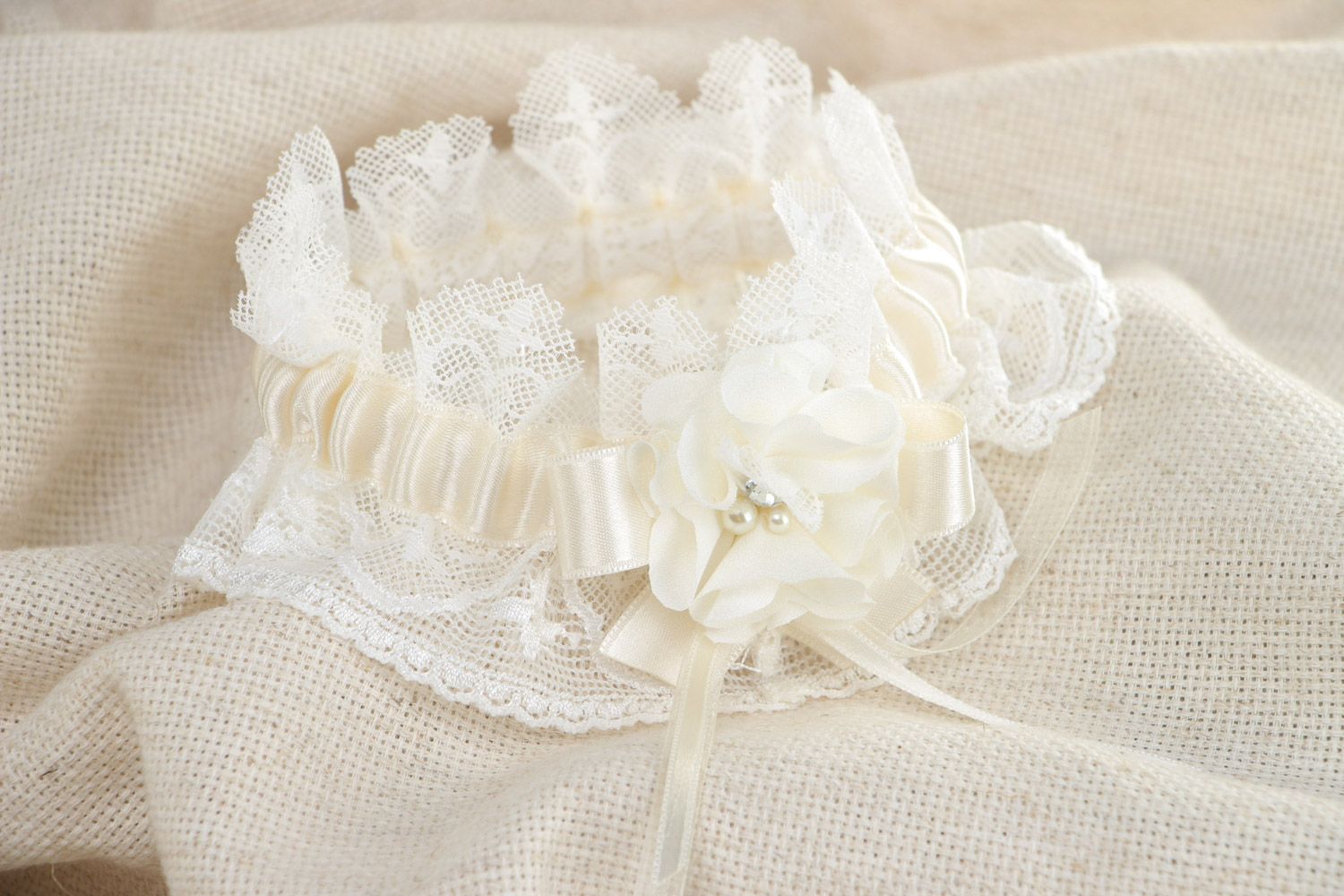 Handmade volume wedding bridal garter with wide white lace and satin ribbon  photo 1