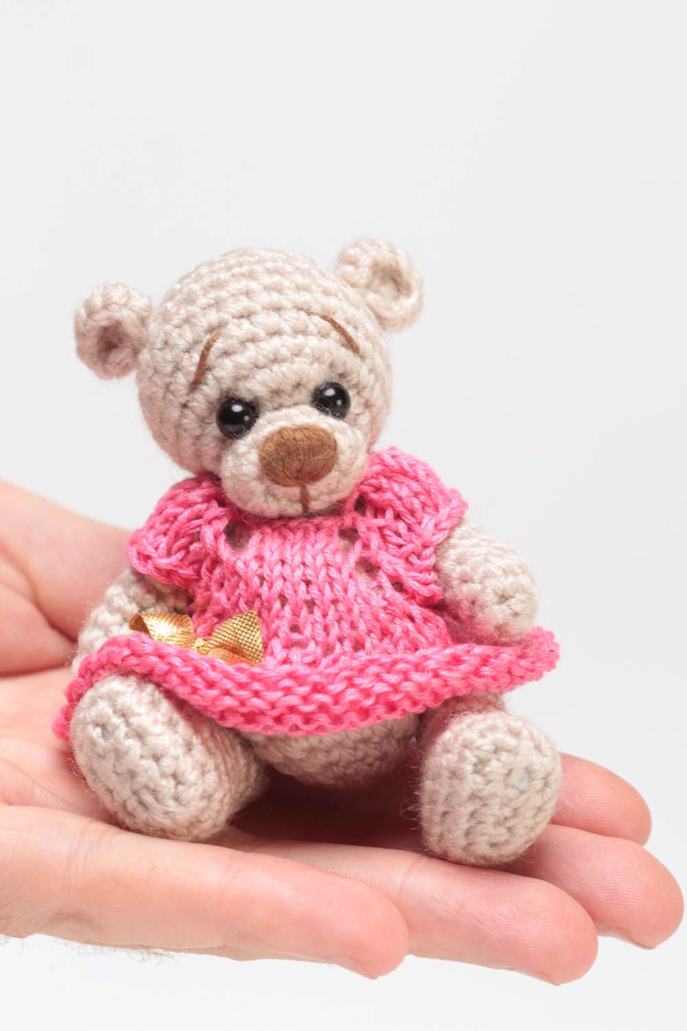 Small handmade beige soft toy bear in pink dress crocheted of acrylic threads  photo 4