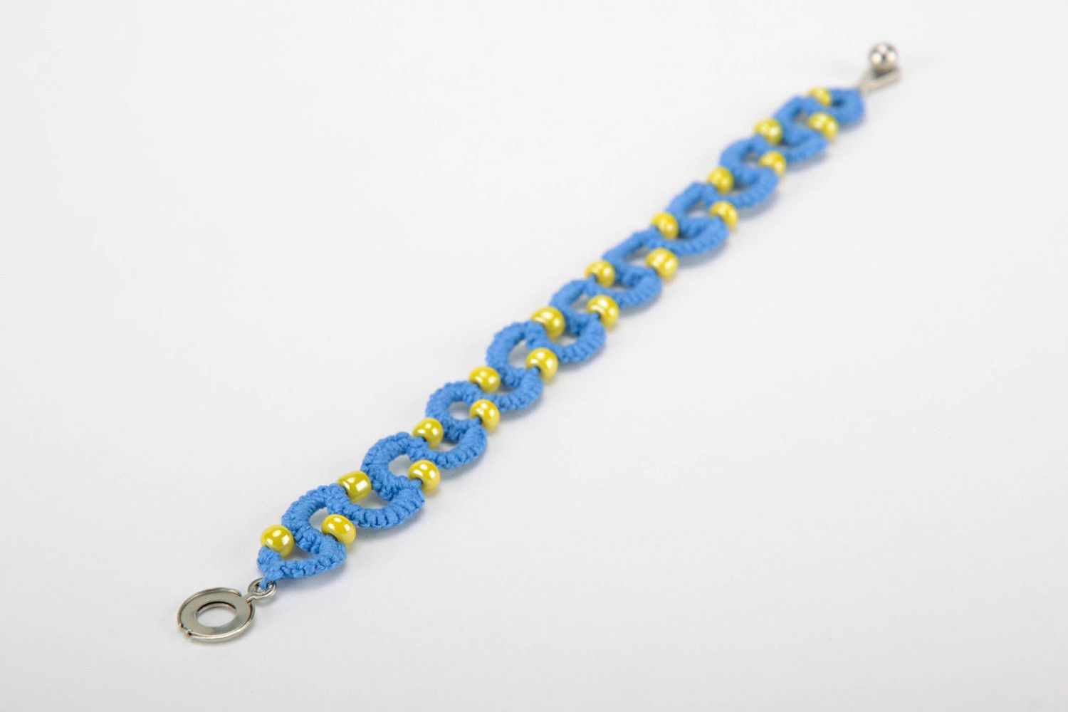 Blue bracelet woven from threads photo 2