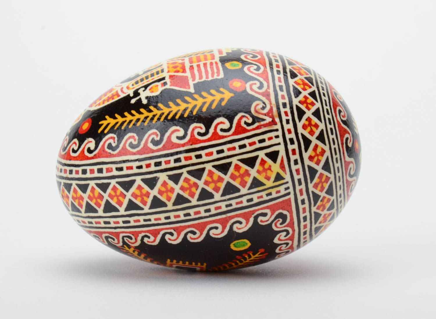 Handmade decorative painted Easter egg with black background and church image photo 3