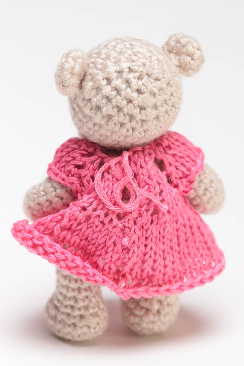 Small handmade beige soft toy bear in pink dress crocheted of acrylic threads  photo 5