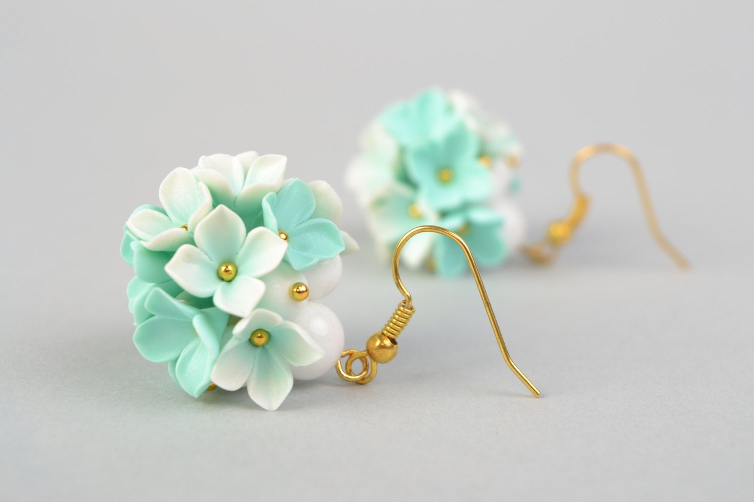 Tender homemade small earrings with polymer clay flowers of mint color shade photo 3
