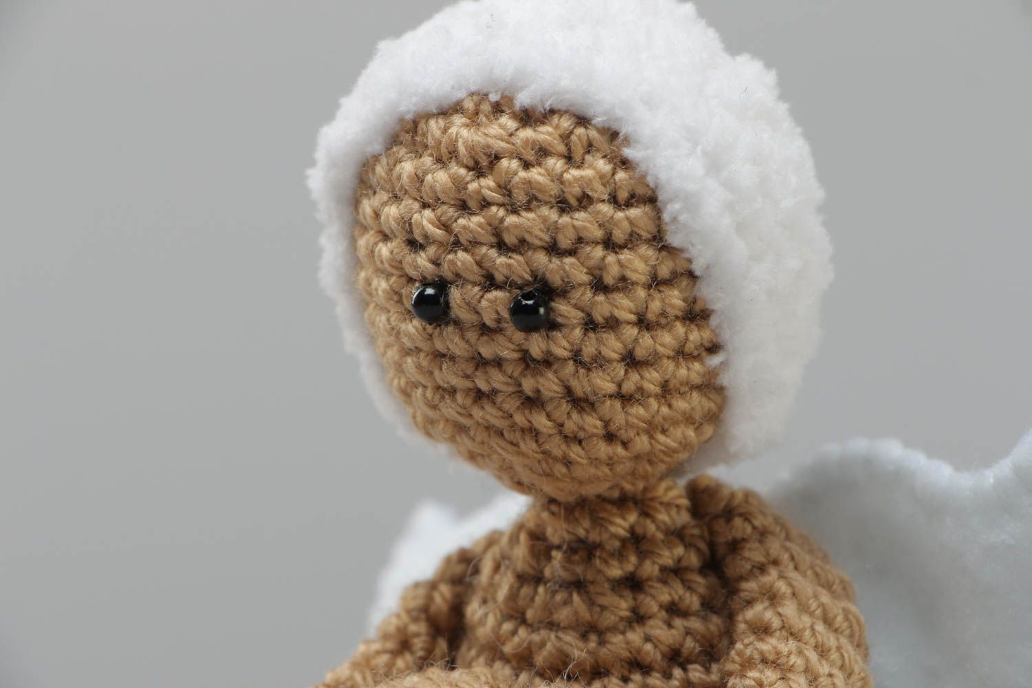 Small handmade knitted angel toy made of acrylic yarn using knitting needle photo 3