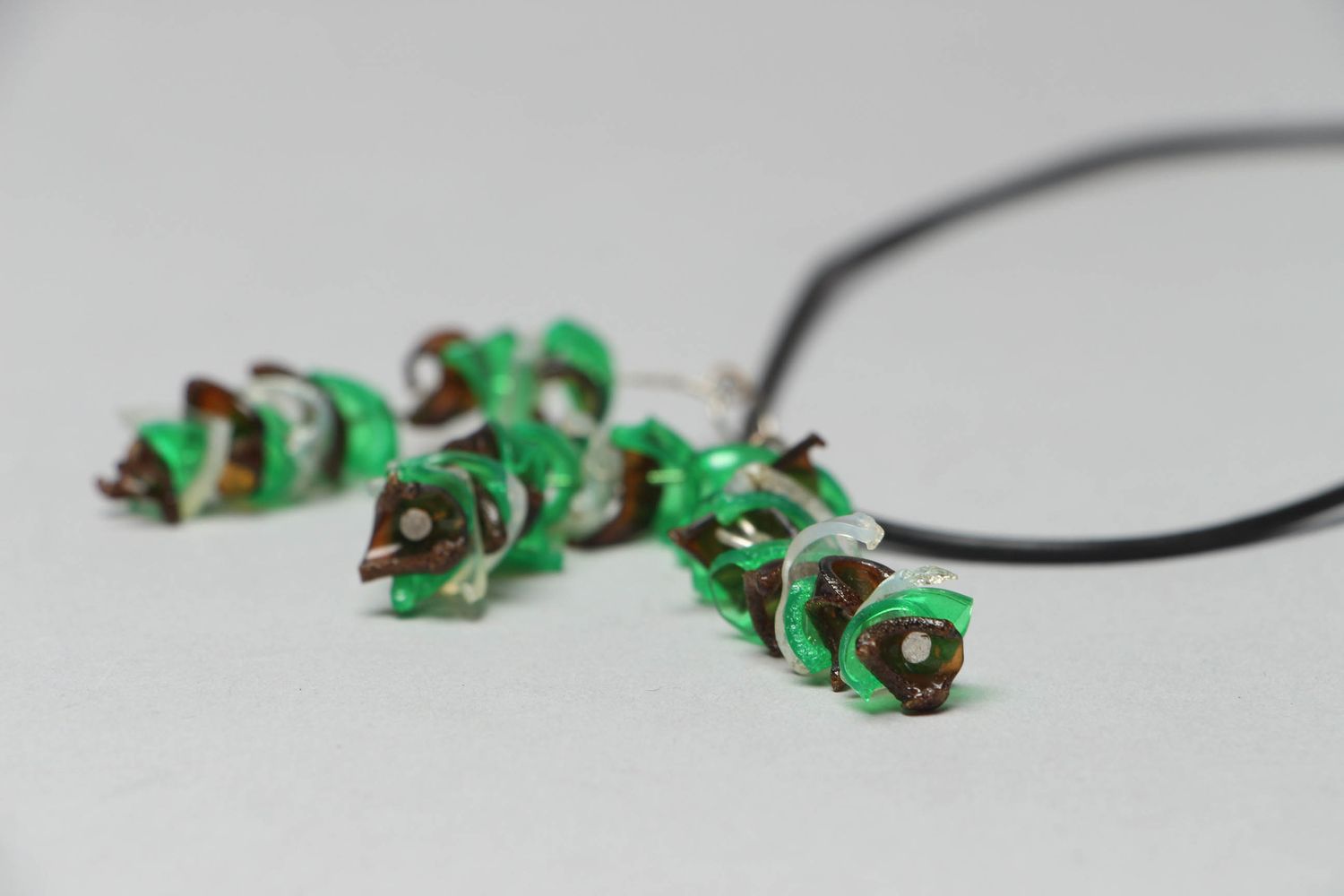 Green plastic pendant on cord photo 3