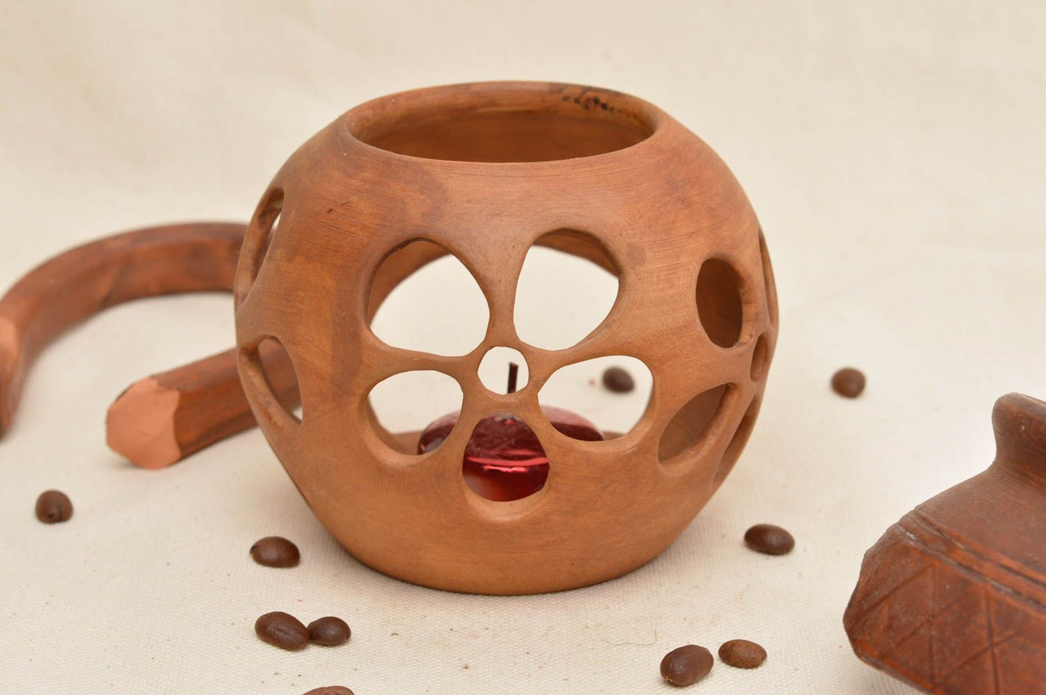 Bougeoir en céramique ajouré en forme de boule brun fait main pour une bougie photo 1