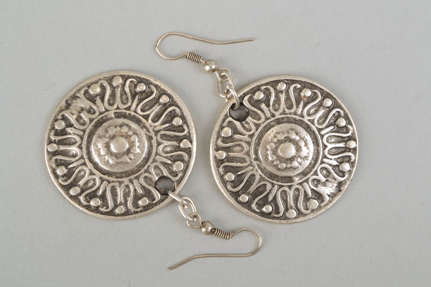 Round ethnic metal earrings with ornament photo 3