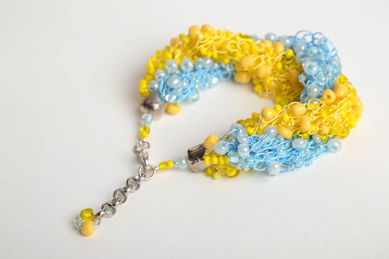 Bright handmade woven wrist bracelet crocheted of blue and yellow Czech beads photo 5