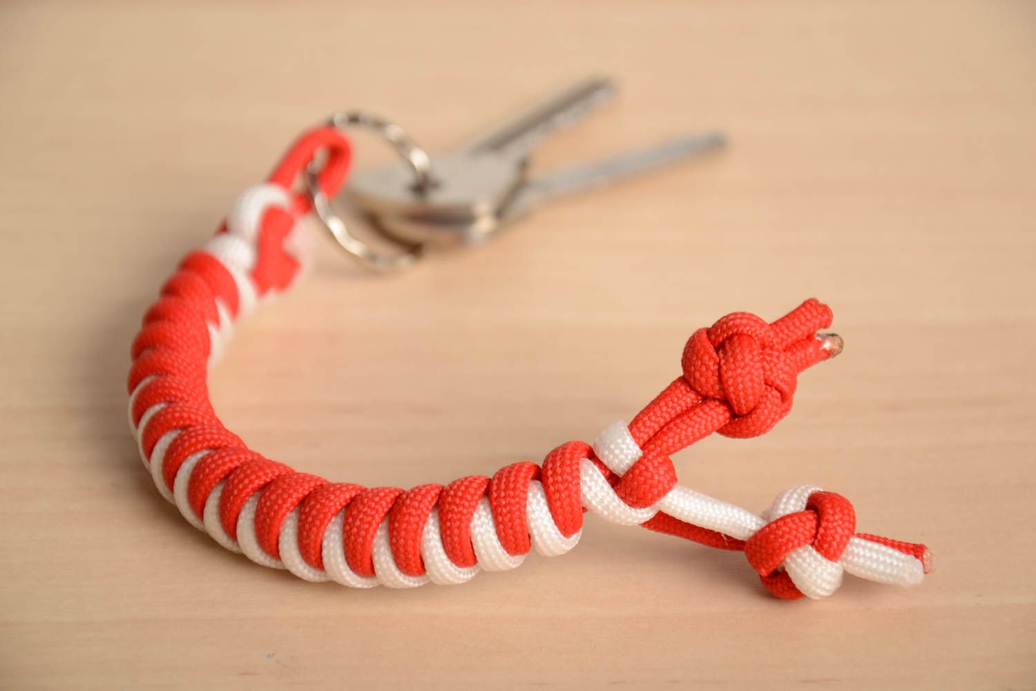 Handmade long stylish keychain woven of red and white parachute cords  photo 1