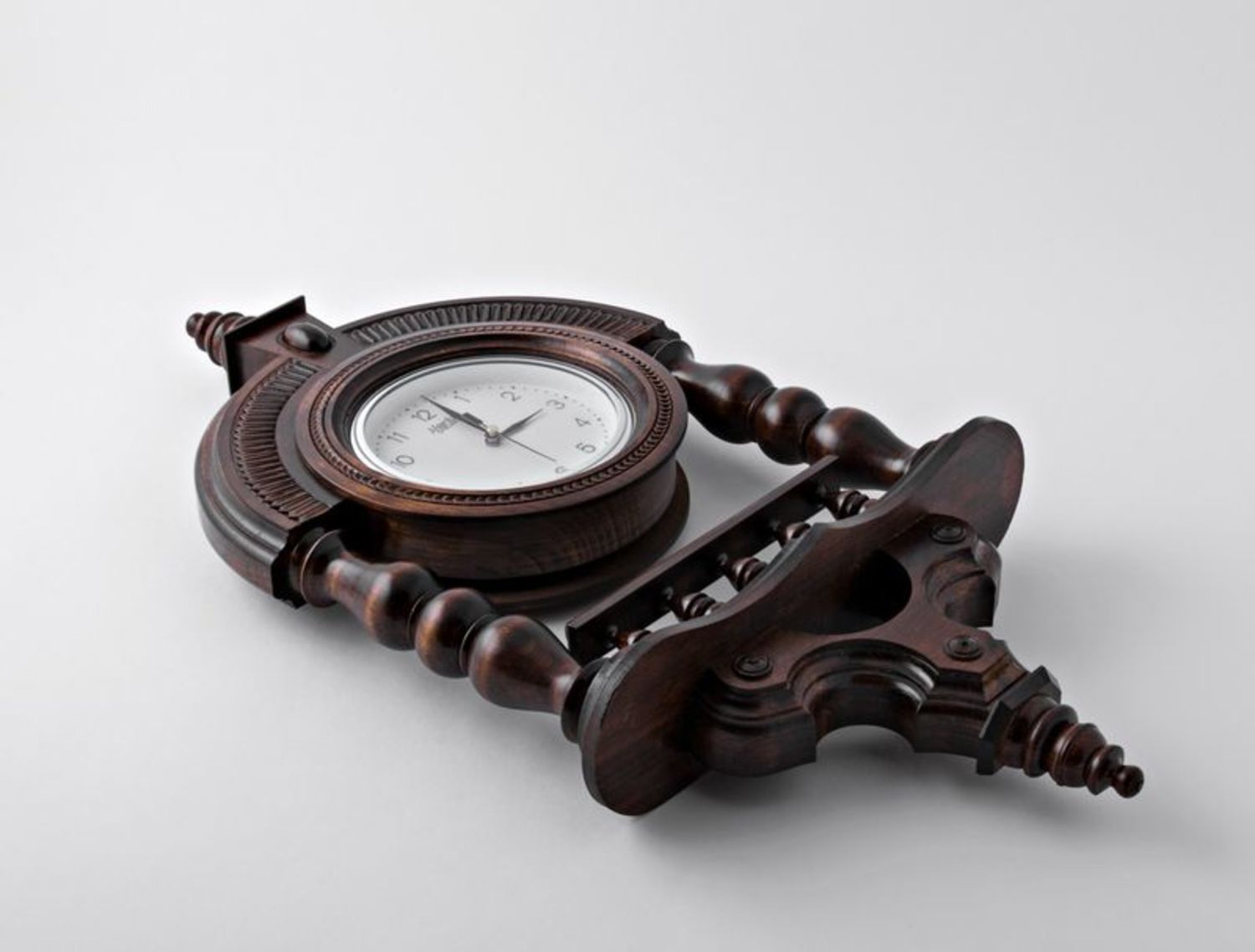 Wooden wall clock with pillars photo 4