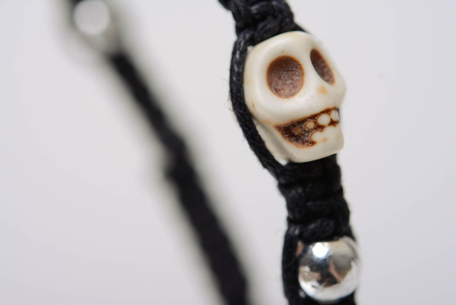 Beautiful unuusal designer handmade woven cord bracelet with beads and skulls photo 3