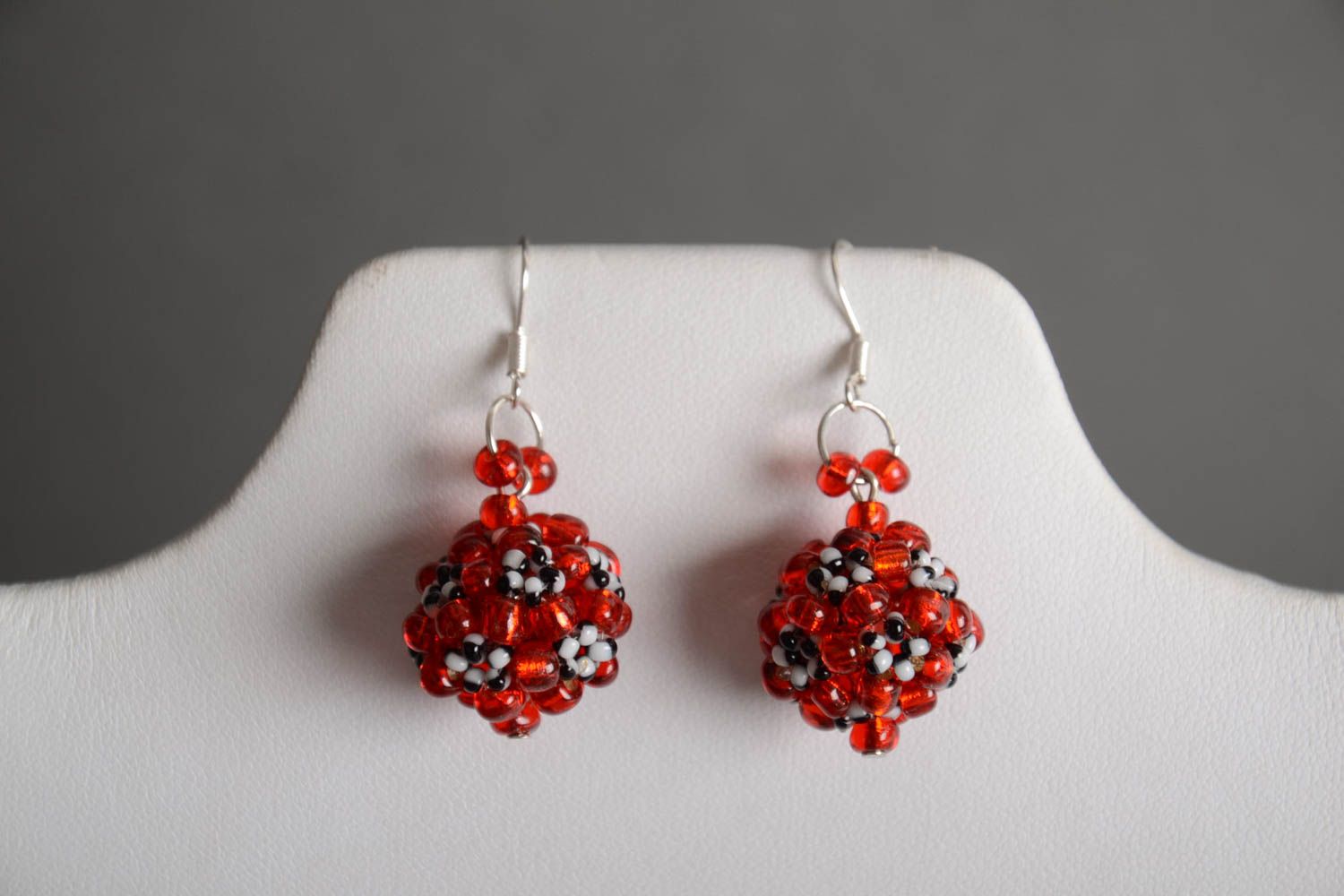 Handmade designer ball shaped dangling earrings crocheted of red Czech beads photo 1