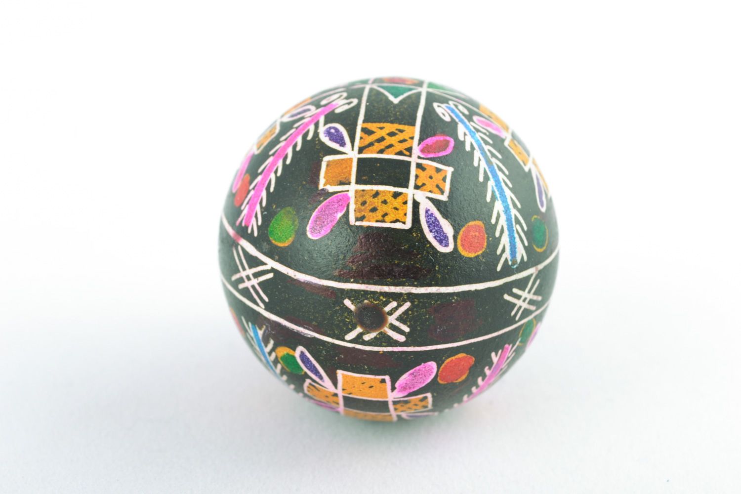 Homemade painted chicken Easter egg with cross pattern on black background  photo 5