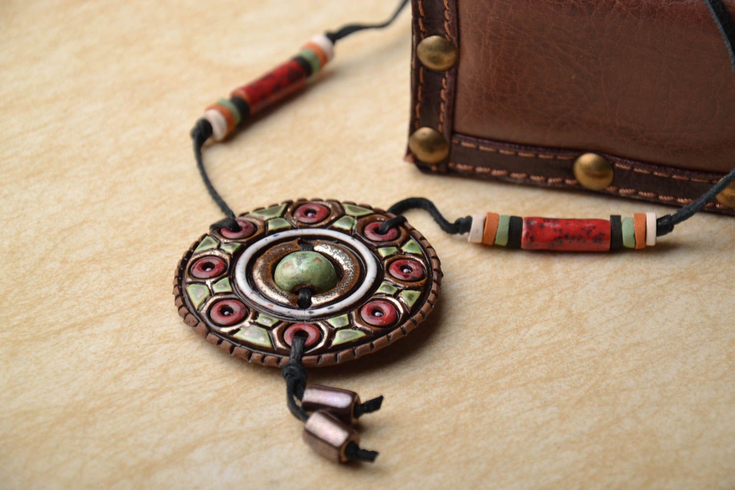 Ceramic pendant with ornament photo 1